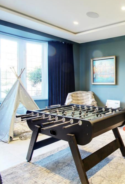 playroom with navy velvet curtains