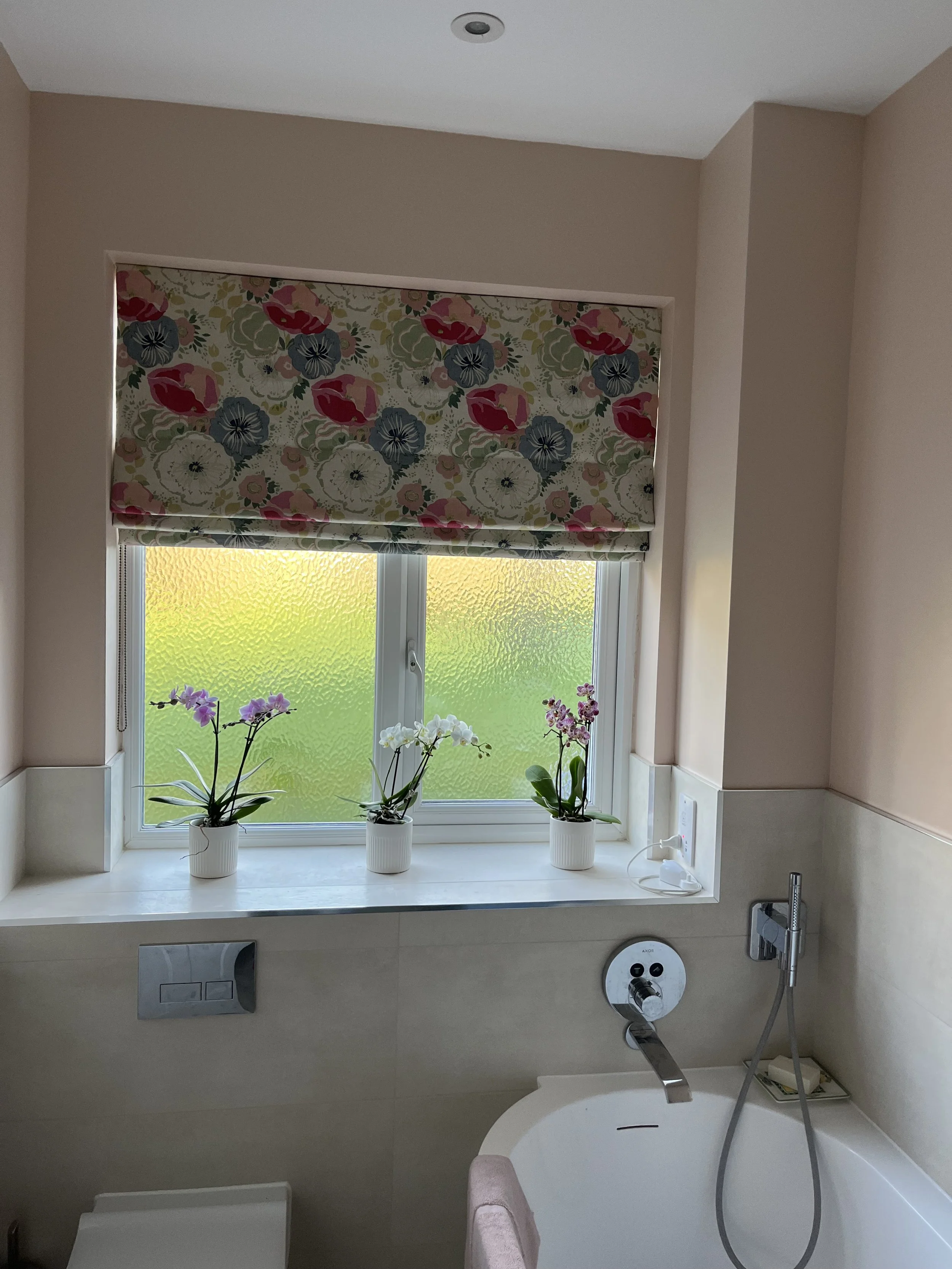 floral roman blind in bathroom