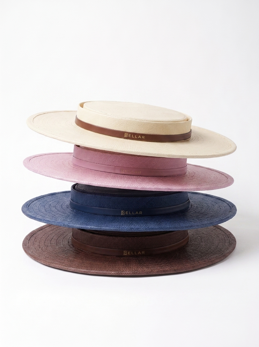 Stack of five wide-brimmed straw hats in beige, pink, navy blue, dark gray, and brown, each with a colored ribbon band and the brand name BELLAR.