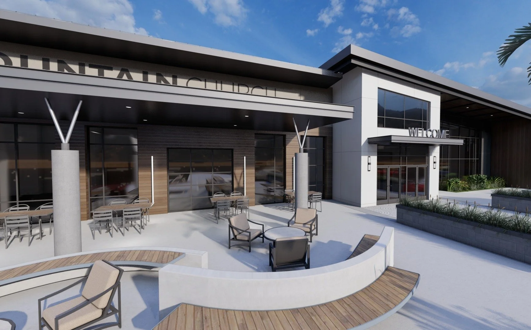 Modern dental clinic building with outdoor seating area, including chairs and tables, under a partly cloudy sky.