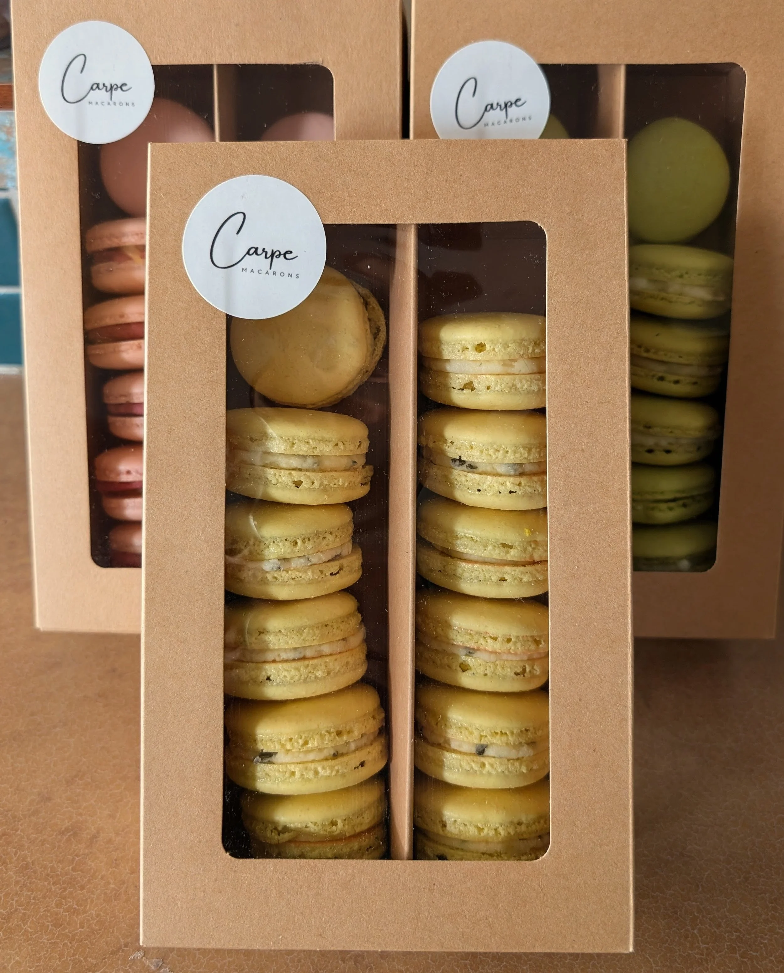 Trio of macaron boxes for a crafting event at Gray Moon Public Market, Raspberry Hibsicus, Peach Green Tea, Pistachio Honey