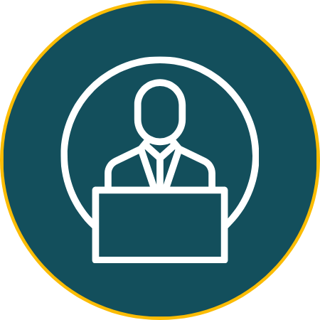 Icon of a person standing behind a podium, representing a speaker or presenter.