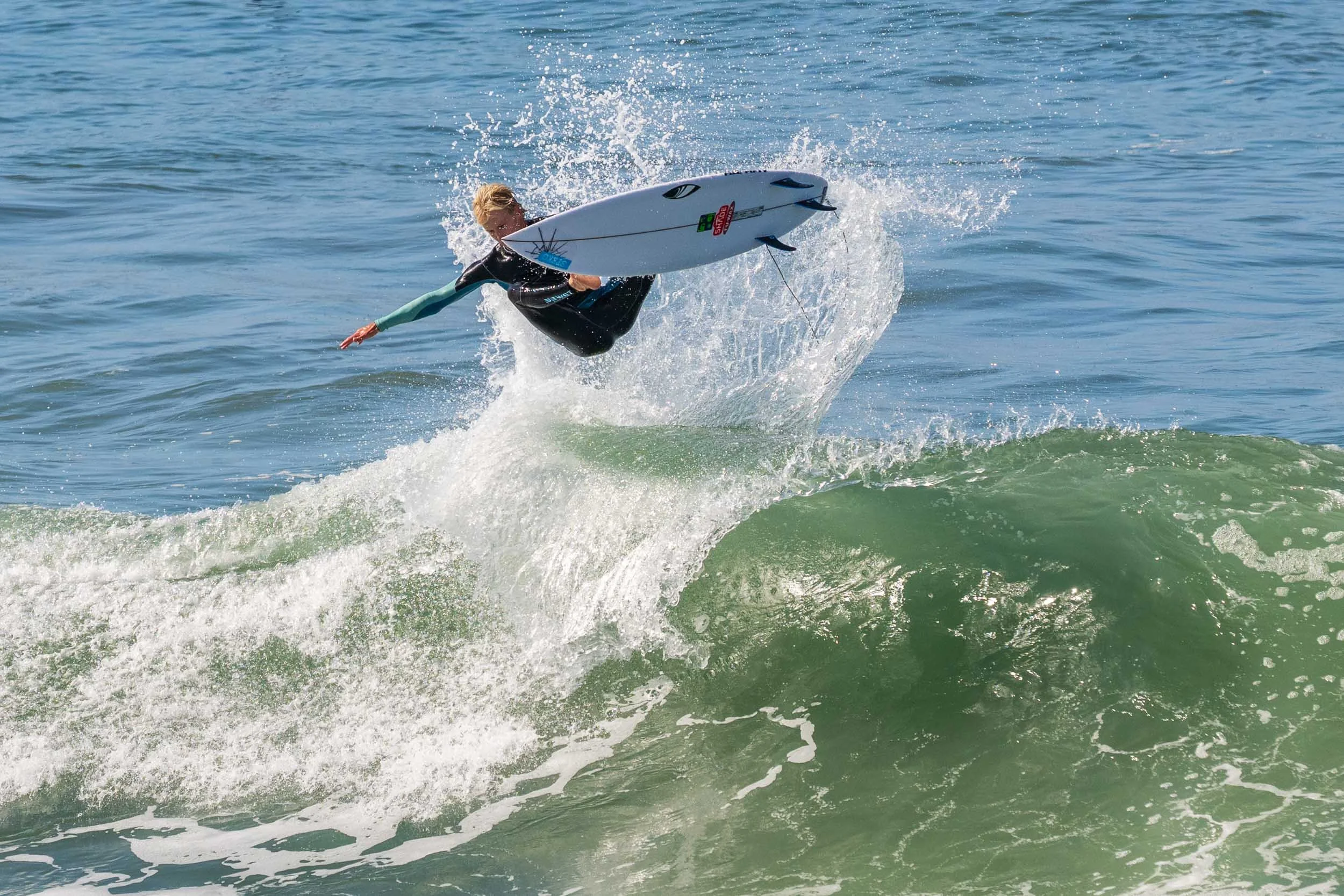 Airborne surfer at Huntington Beach