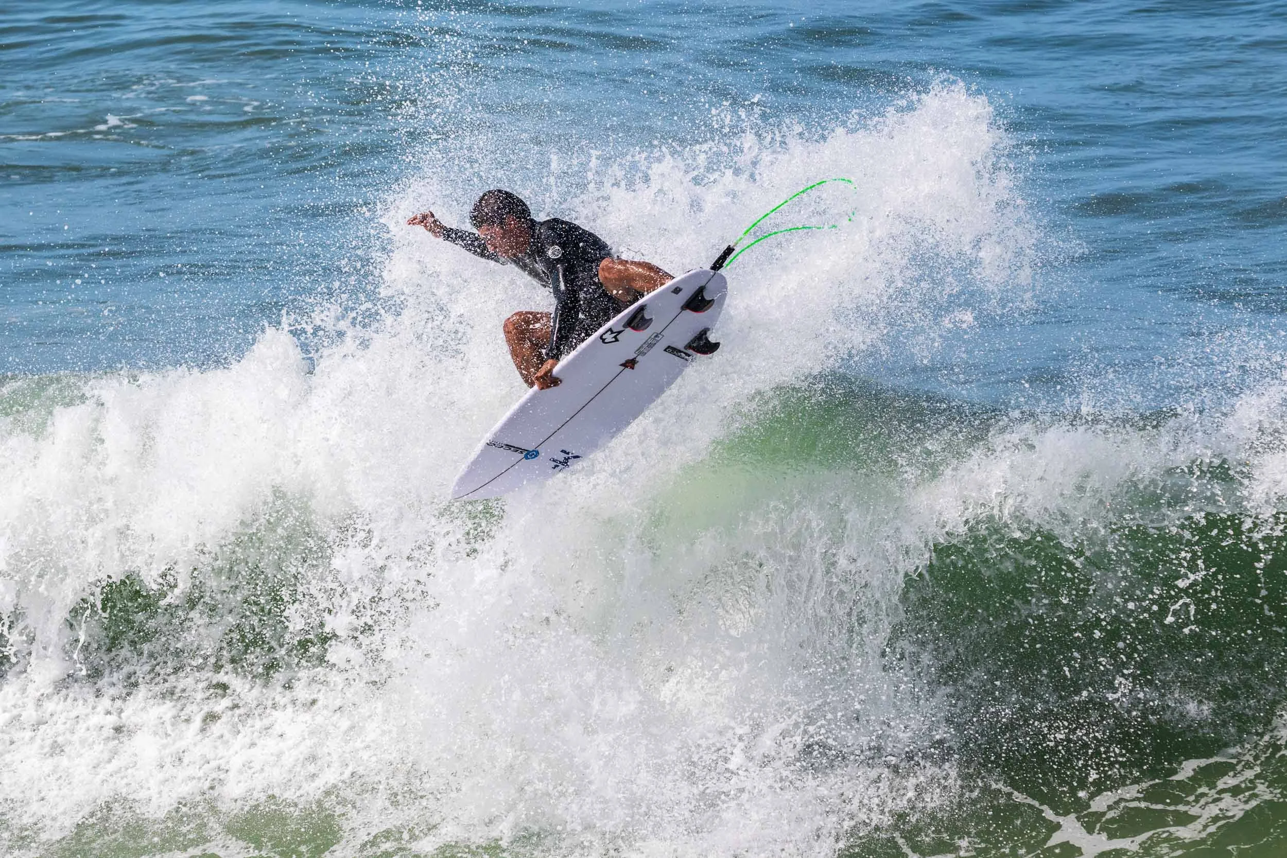 Airborne surfer at Huntington Beach