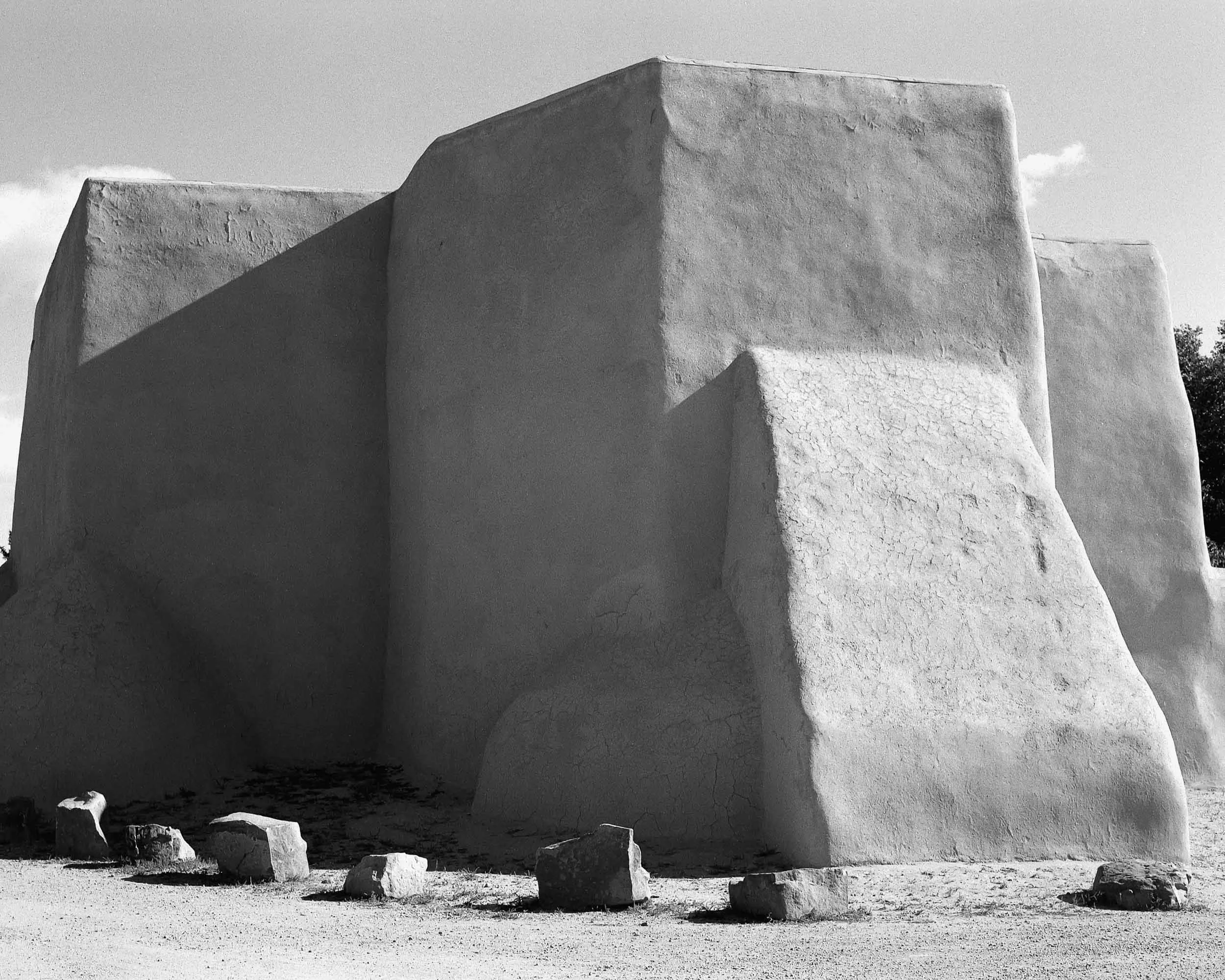 Black and white photograph of large adobe-style building