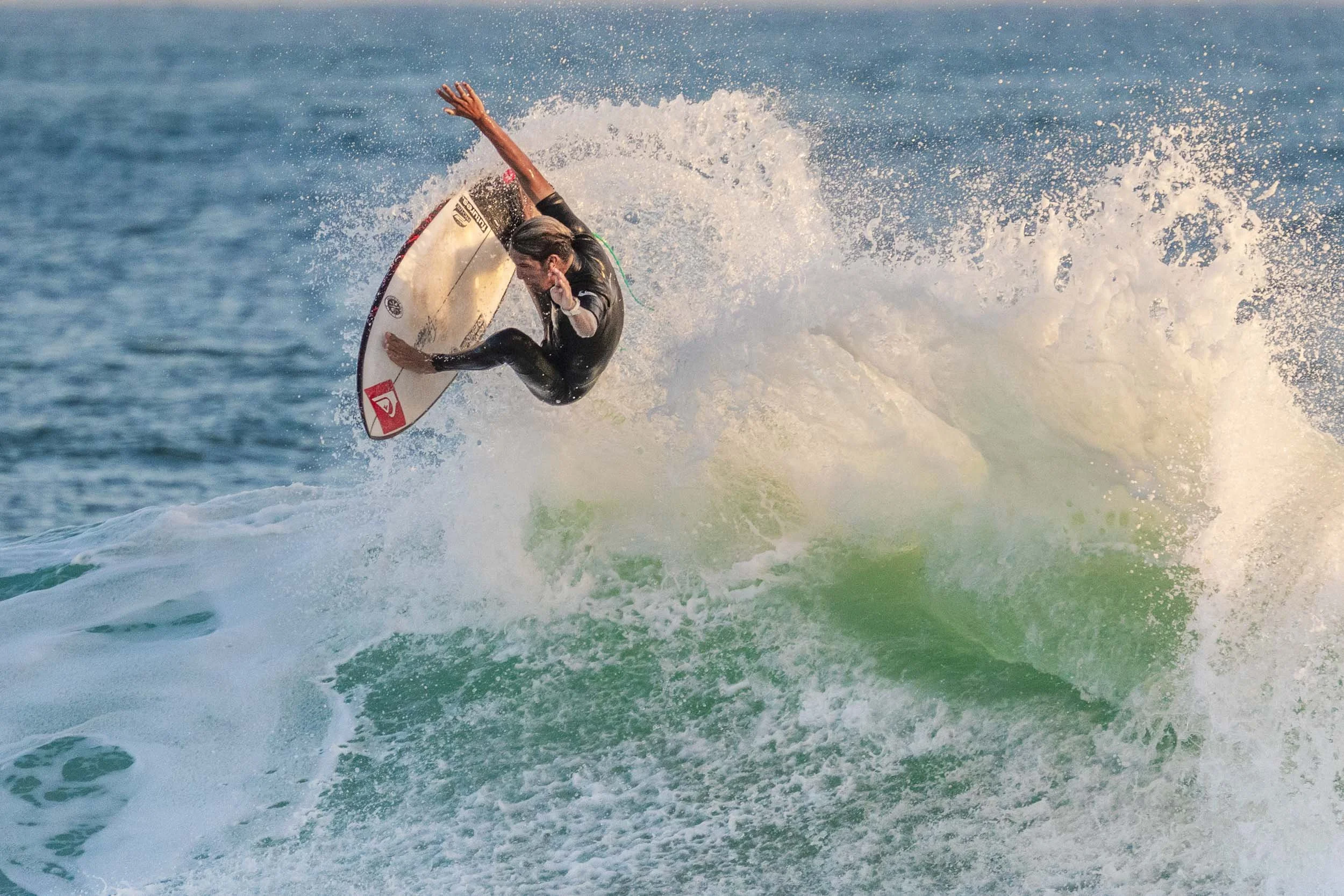 Airborne surfer at lower trestles