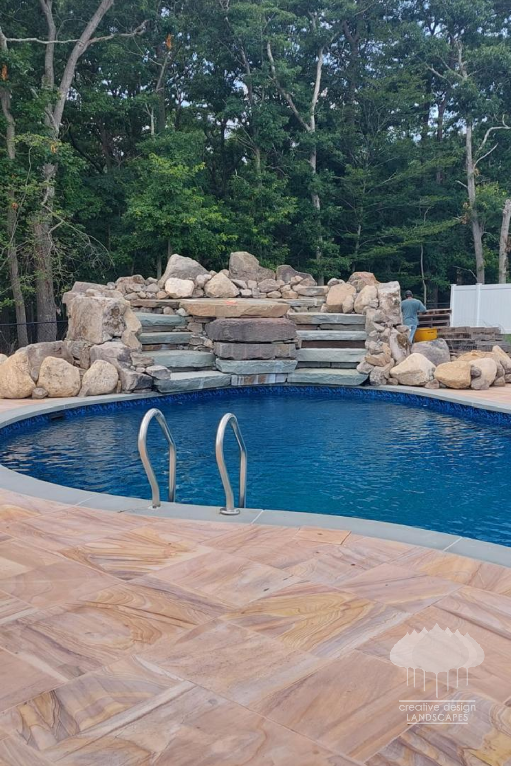 natural-stone-pool-waterfall-deck.png