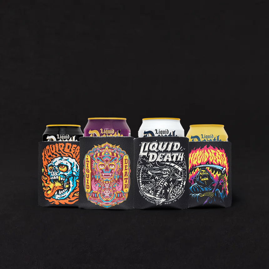Four cans of Liquid Death water with colorful, labels, each featuring a different spooky or gothic illustration, placed inside a black koozie with similar artwork.