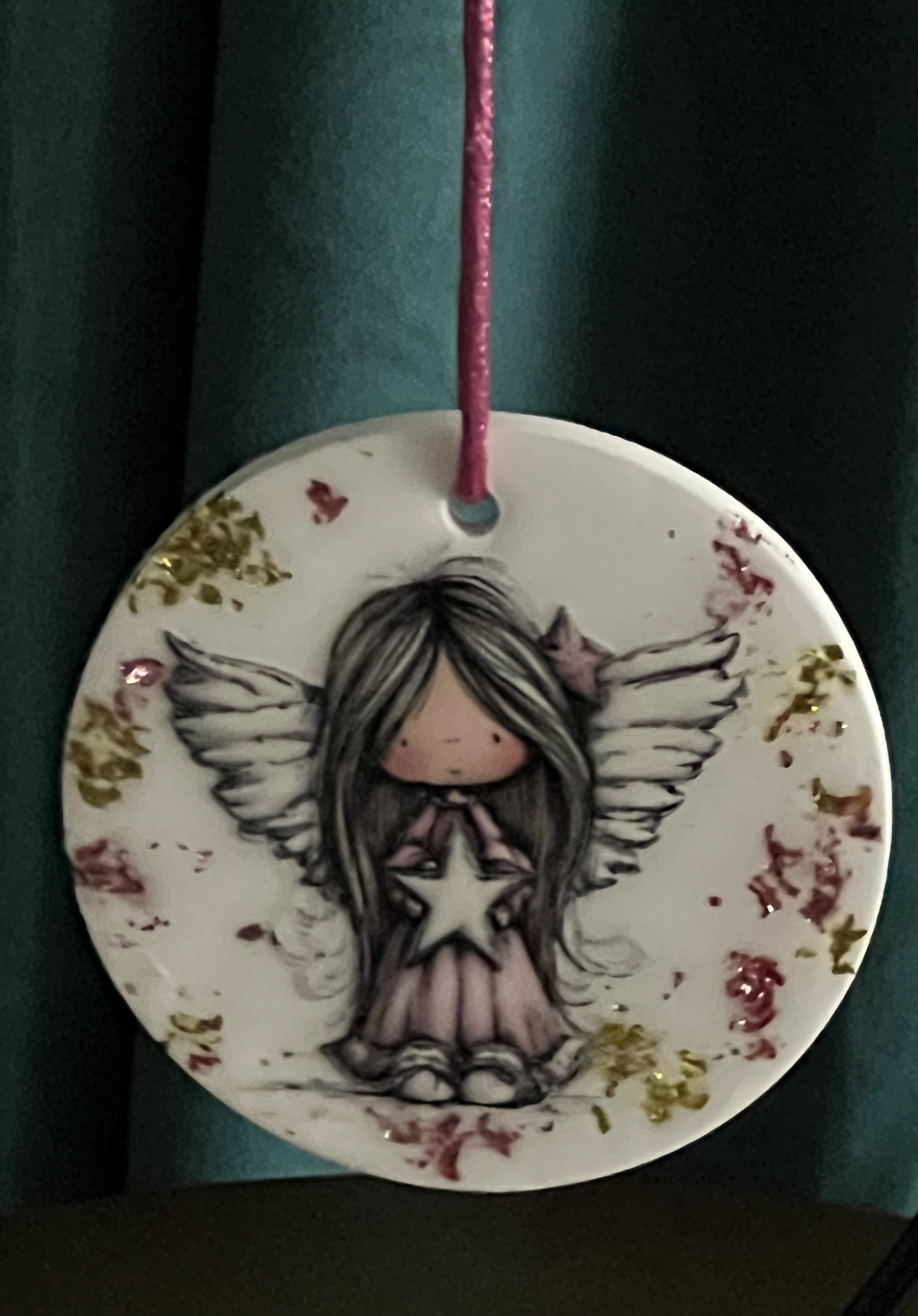 Whimsical Angel Holding A Star Ornament
