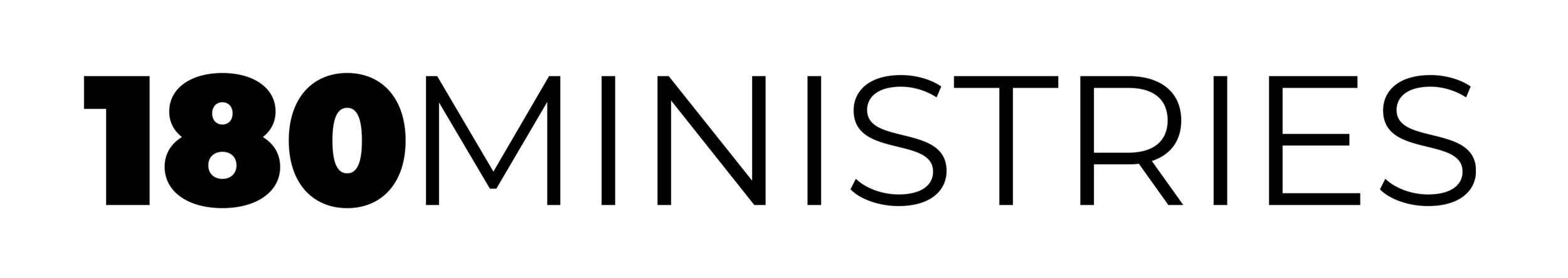 Close-up of a barbell with black weights on each side, and a silver bar in the middle, on a gym floor.