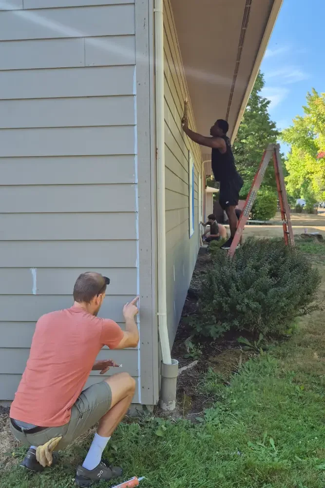 Men prepare Calvin Presbyterian Church for painting.