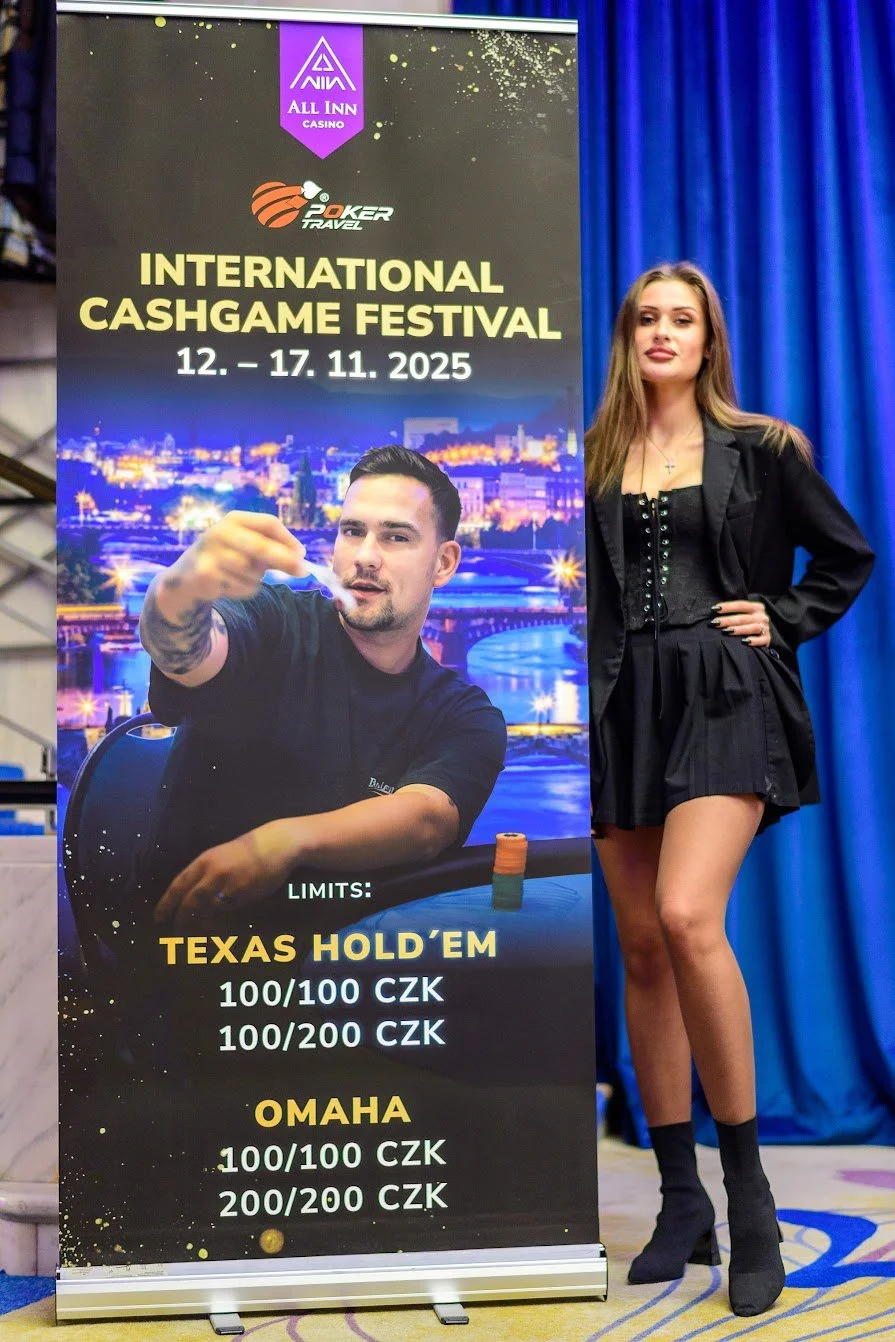 A woman standing next to a large promotional poster for the International Cashgame Festival, taking place from November 12 to November 17, 2025. The poster features a man playing poker and information about the Texas Hold'em and Omaha limits in Czech