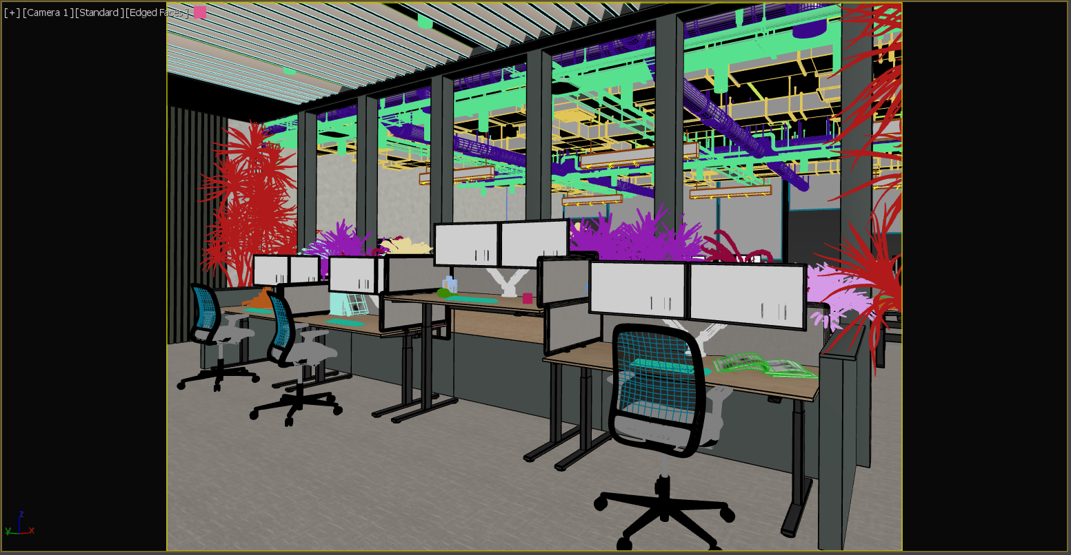 A modern office workspace with desks, chairs, computer monitors, and large indoor plants, with an industrial ceiling exposed to colorful piping and ductwork in the background.