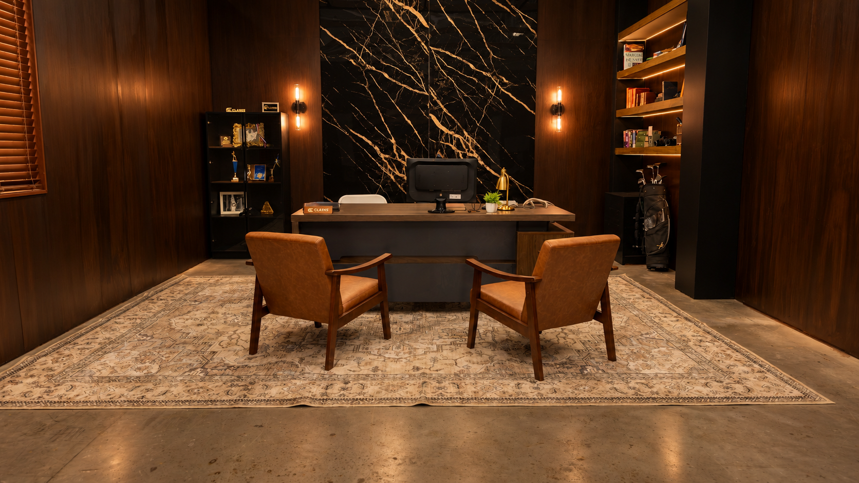 An elegant office with dark wood-paneled walls, a black marble accent wall behind the desk, and warm lighting. The office has a large desk with a computer, a potted plant, a gold desk lamp, and a chair. There are two brown leather armchairs in front of the desk, a bookshelf with books and golf clubs, and a decorative rug on the floor.