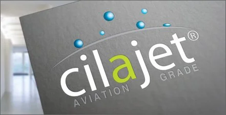 A logo for CilaJet, a company specializing in aviation grade services, featuring stylized text with a green and white color scheme and blue circles.