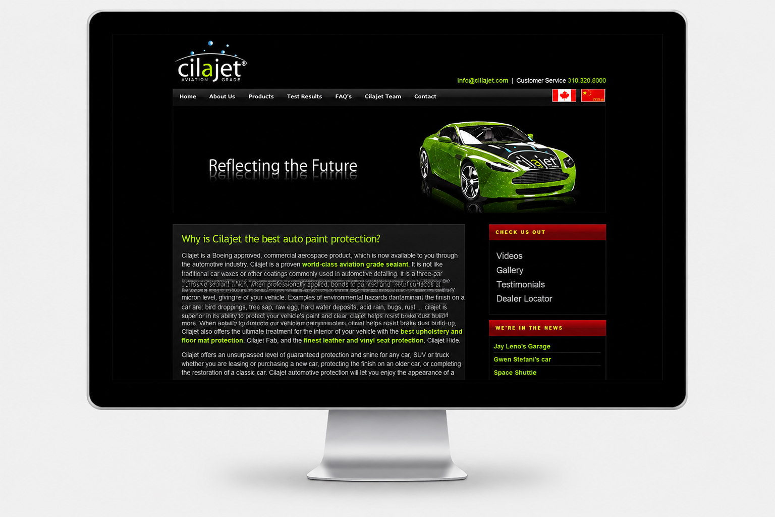 Computer monitor displaying a website for Cilajet, a car paint protection product, with a green sports car and menu options on a dark background.