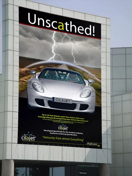 Large billboard advertisement featuring a silver sports car with stormy sky and lightning in the background, promoting Cilajet with the text "Unscathed!" at the top.