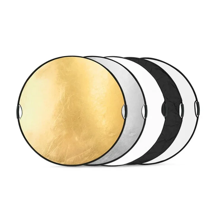 Set of four collapsible reflectors for photography, in gold, silver, black, and white colors.