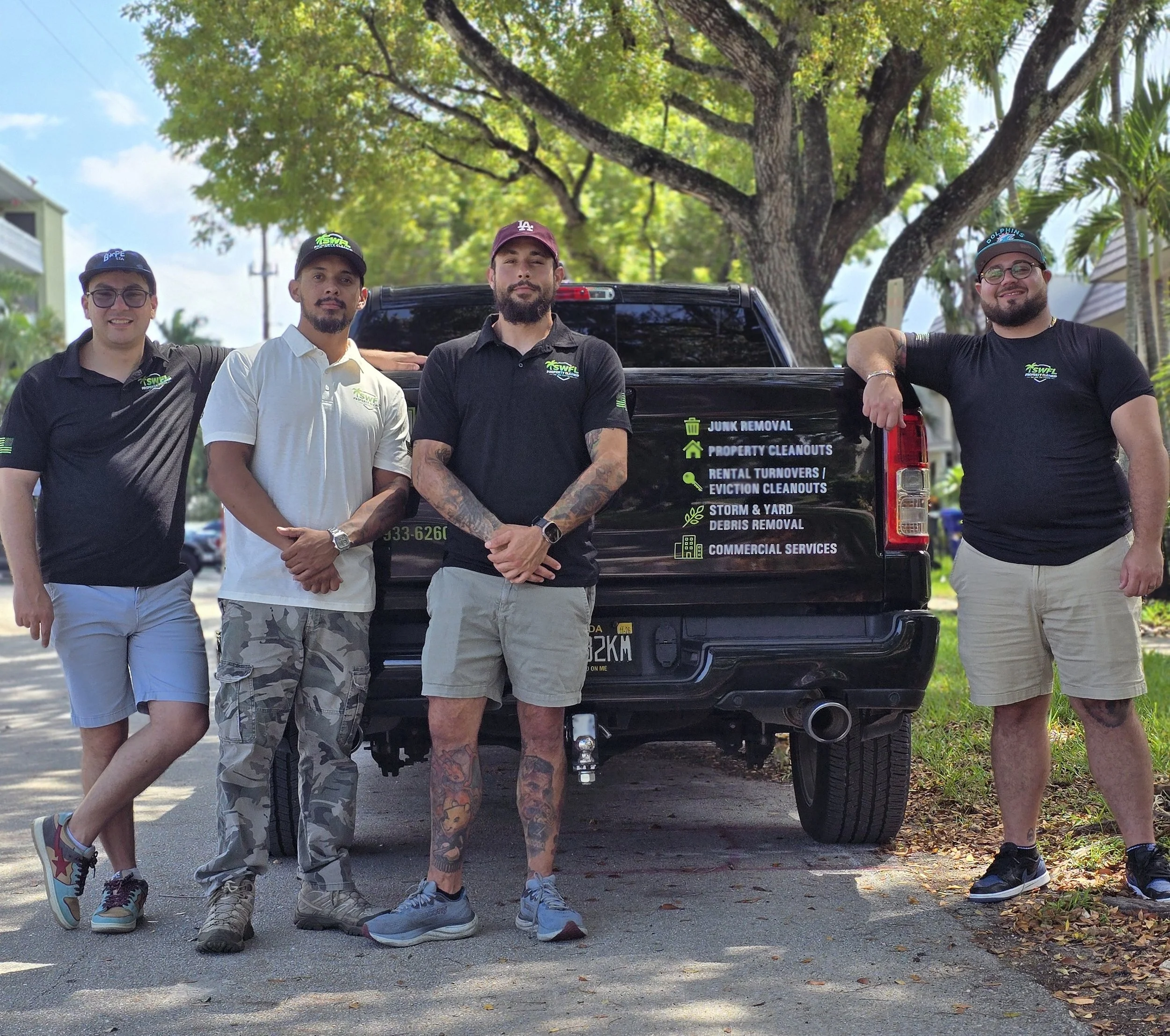 SWFL Property Cleanup team standing besides the company truck in Southwest Florida