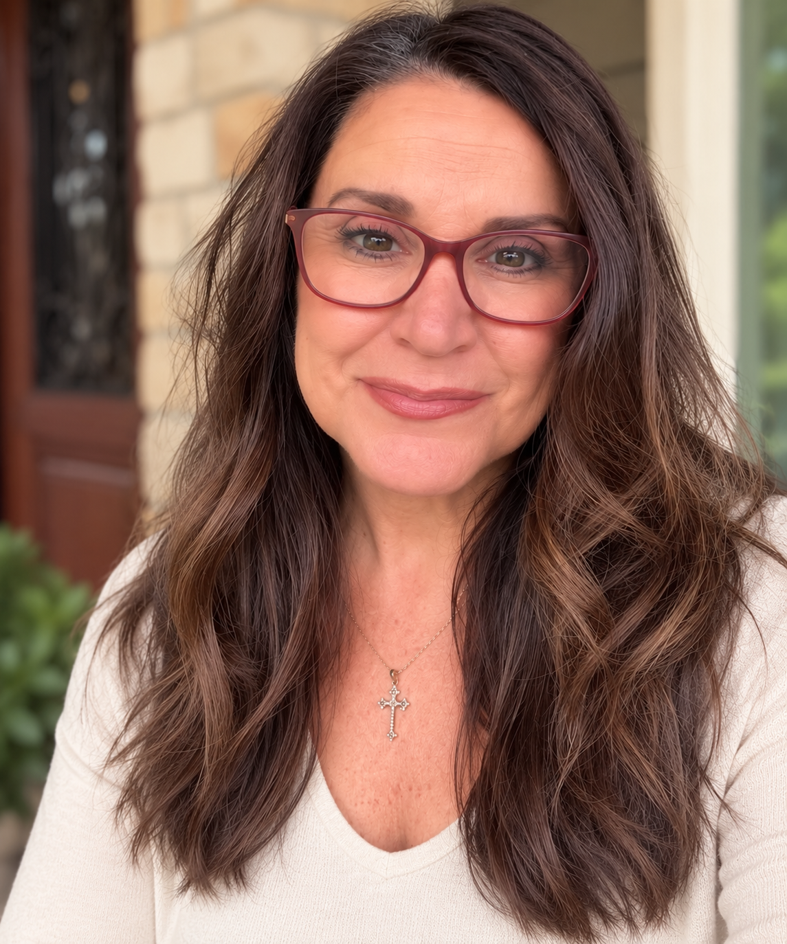 Teddi Eakins, founder of The Missing Perspective™, smiling at the camera.