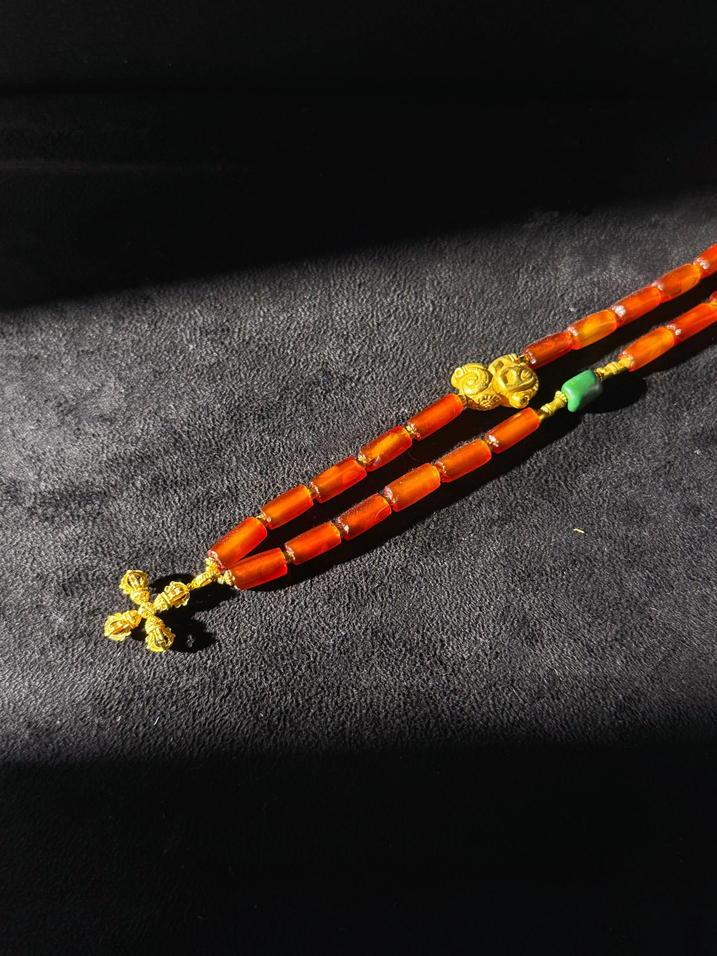 necklace w gold Persimmon Calyx Motif bundled display.jpg