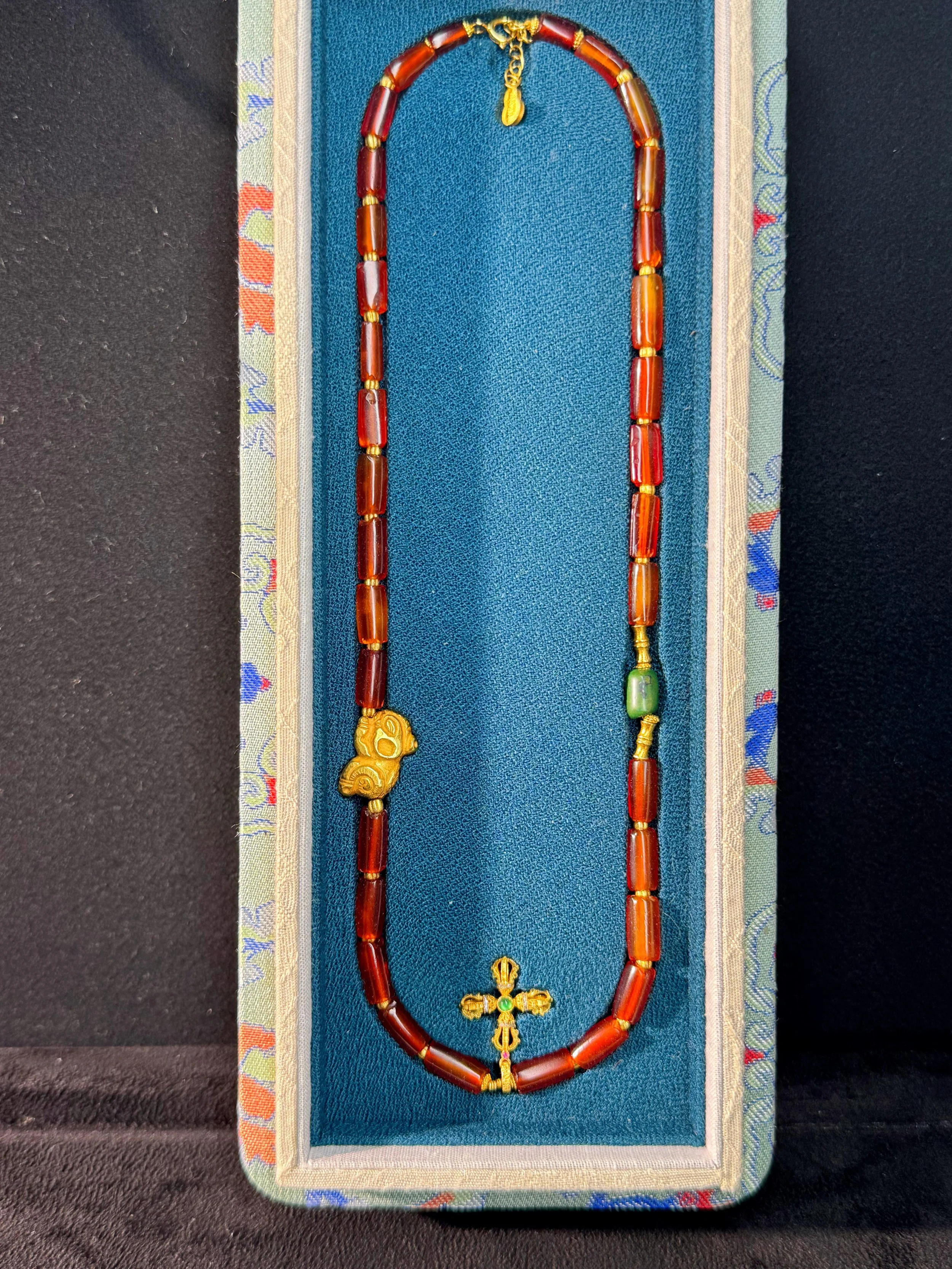 necklace w gold Persimmon Calyx Motif.jpg