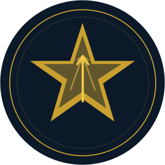 A circular emblem with a gold star in the center and a black background, featuring a compass needle pointing upward.