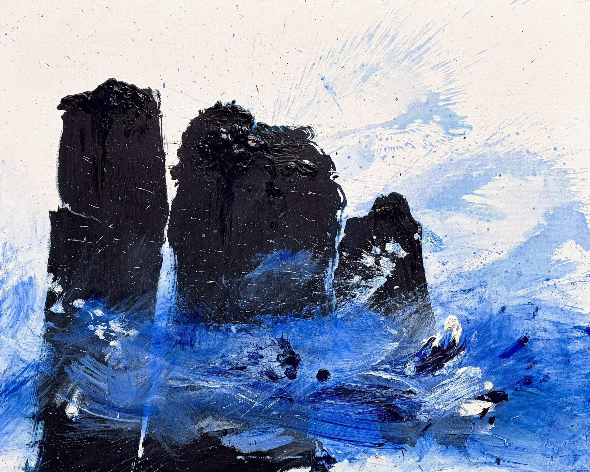 An abstract painting with black, blue, and white paint on canvas. The artwork features thick black shapes resembling mountains or rocks, with splashes and streaks of blue and white, creating a dynamic and textured composition.