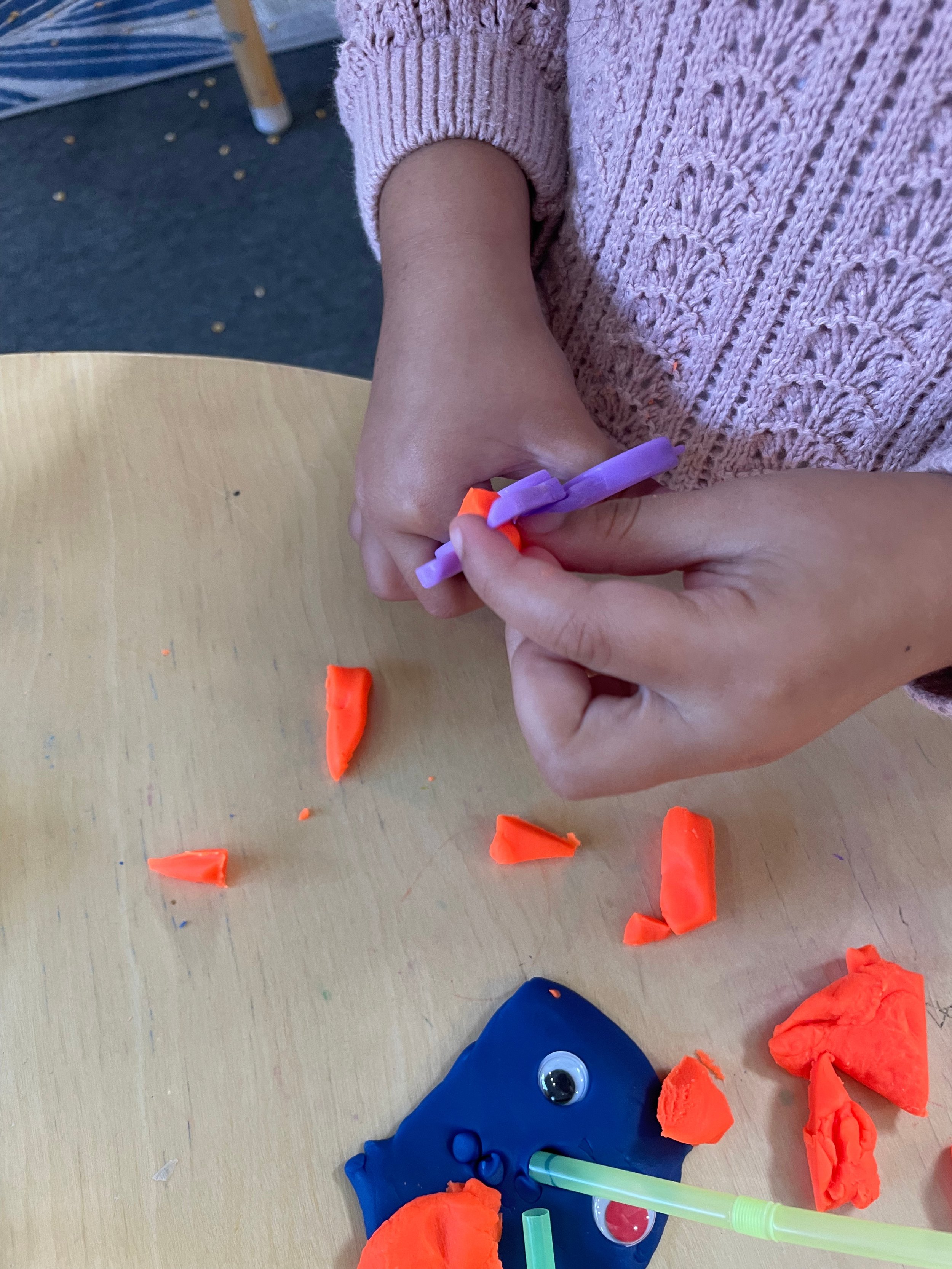 cutting playdoh.jpeg