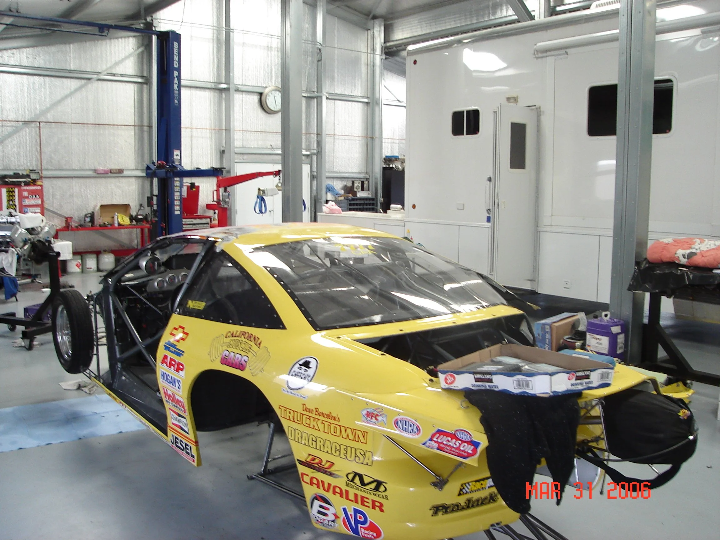 Metal building race car mechanics shop.