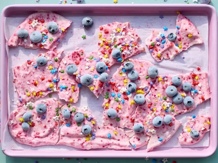 This unicorn frozen yogurt bark is a great make-ahead and freeze kid-friendly afternoon snack or treat. Customize with desired flavors. We used freeze-dried raspberry powder to tint the yogurt, but you can use your desired food coloring instead.