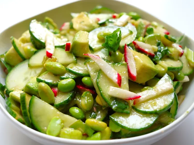 Fresh crunchy cucumber and edamame salad with avocado, radishes, green onions, and cilantro tossed in sesame dressing.