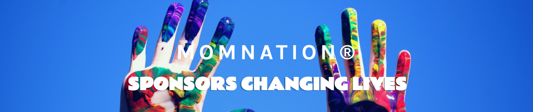 Two hands raised against a blue sky, painted with colorful, swirling patterns, accompanied by the text 'MOMNATION SPONSORS CHANGING LIVES'.