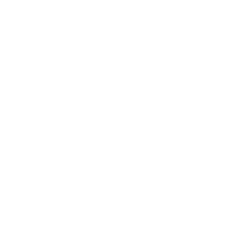 Sunset over water with rays of sun shining upward