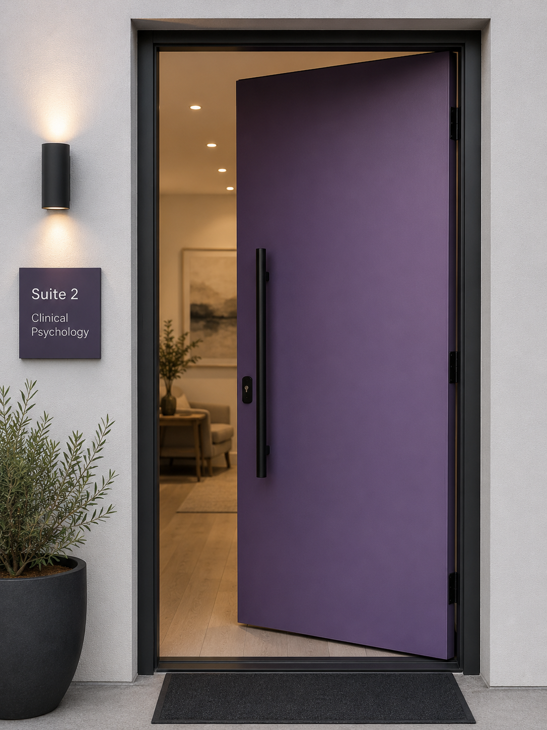 The branding of an entrance to a clinical psychology office with a partially open purple door, a potted plant beside the door, and a sign that reads 'Suite 2, Clinical Psychology' on the wall.