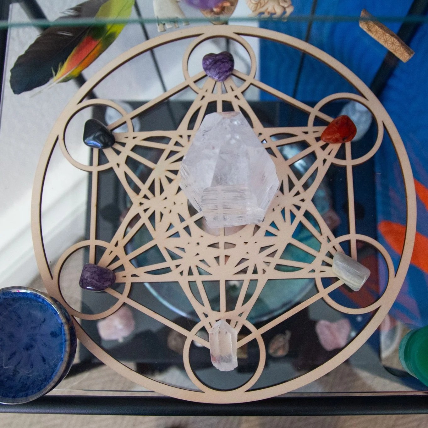 close up photo of crystals and sacred geometry that can be found in Ember & Flow's South Denver massage therapy studio