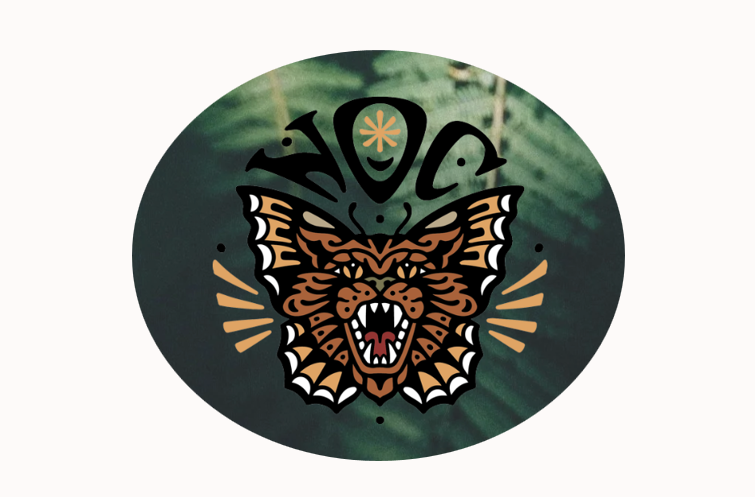Illustrated logo featuring a fierce, roaring tiger's face with detailed orange, black, and white markings, surrounded by decorative elements and the stylistic text 'Maui' above.  Logo for a wellness friend that this massage therapy studio endorses.