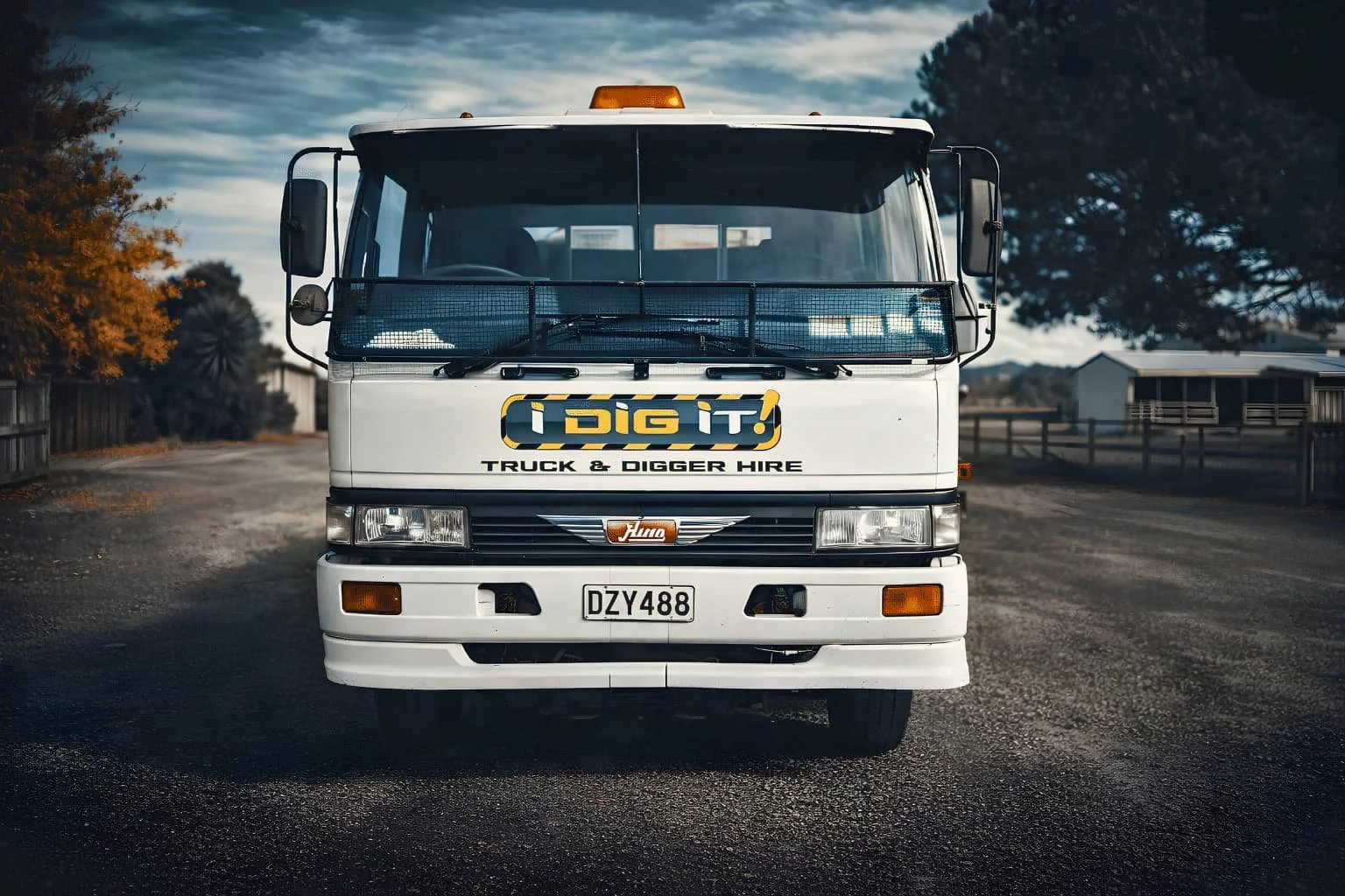 I Dig It Limited Truck featuring the logo and the words Truck and Digger Hire on it, parked at the workshop in Clive