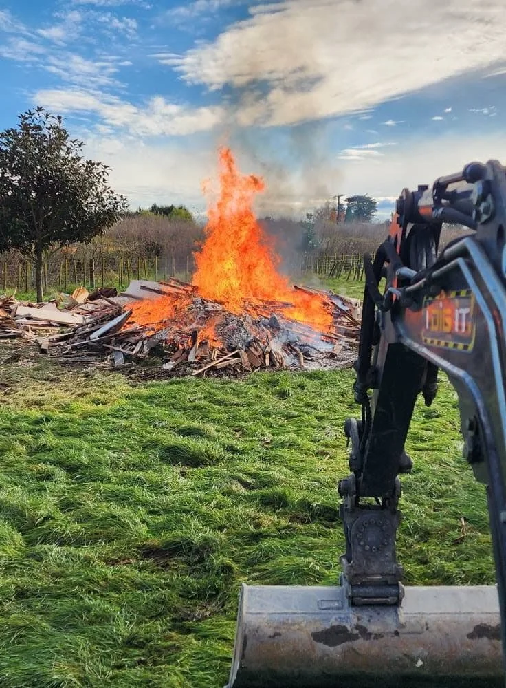 I Dig It Digger clearing and burning green waste during land preparation in Hawke's Bay