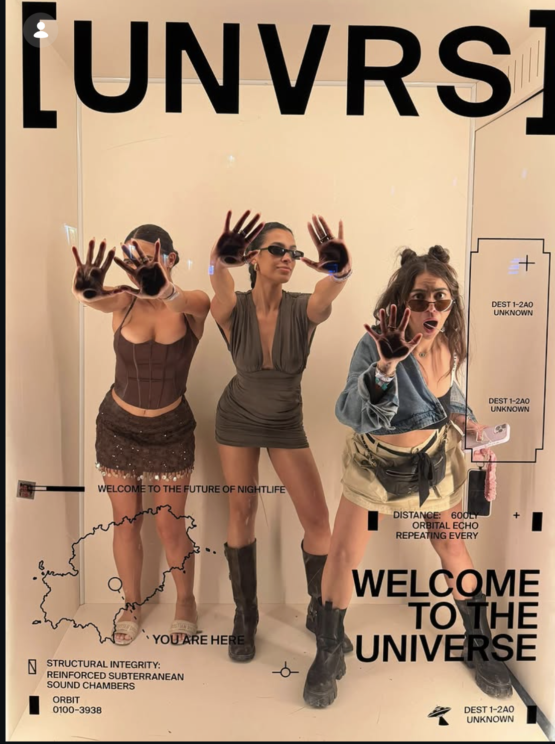 Three women posing in front of a mirror with graphics and text, dressed in fashionable outfits with one woman wearing sunglasses and another holding a phone.