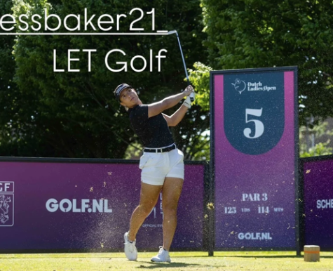 Female golfer in black shirt and white shorts swinging a golf club on a golf course during daytime. There is a purple sign with the number 5 and the text 'Par 3,' '125 yards,' and '114 meters' in the background, along with a purple barrier and trees.