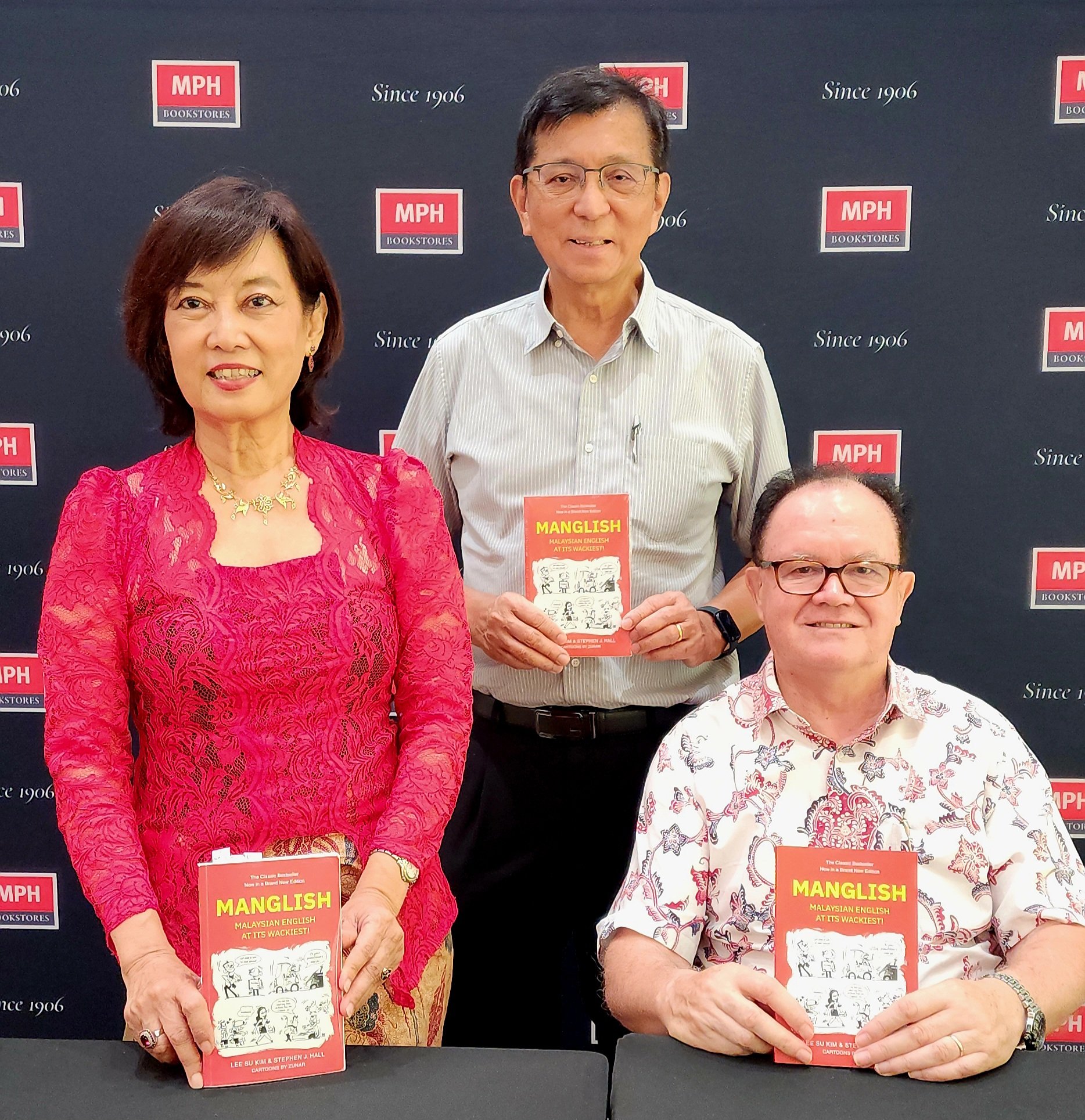 Lee Su Kim, Dr Stephen J Hall and World Scientific publisher Chua H.K. Signing event, of Manglish: Malaysian English at Its Wackiest'3rd edition' with a backdrop displaying logos of MPH Bookstores,  Malaysian bookshop. March 2 026