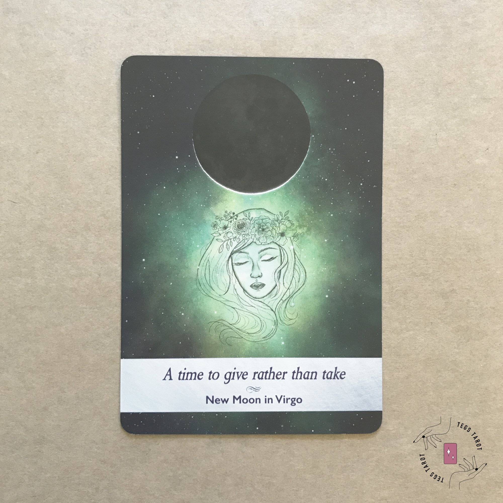 New Moon In Virgo Tarot Card on brown background