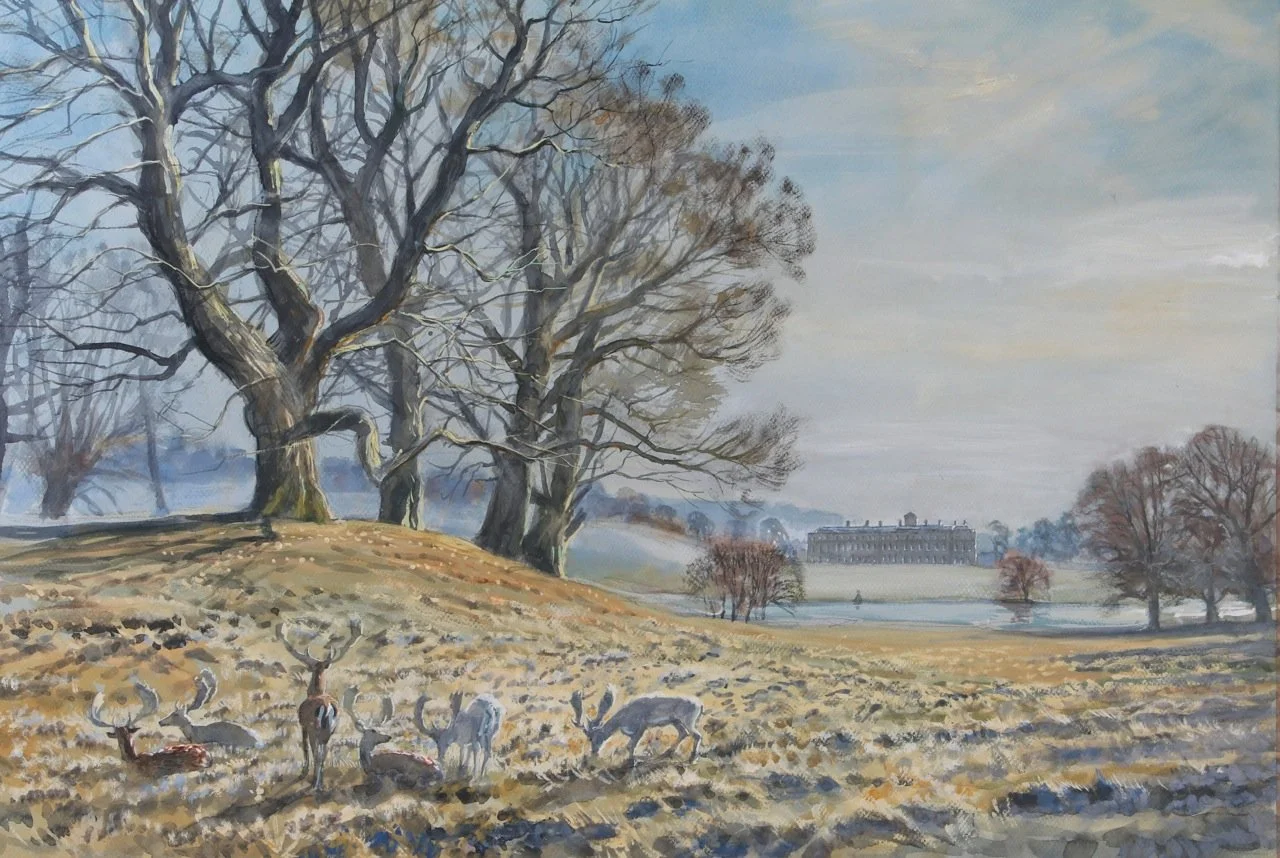 A peaceful winter landscape with leafless trees, a group of deer grazing on the ground, and a large historic building in the distance under a partly cloudy sky.