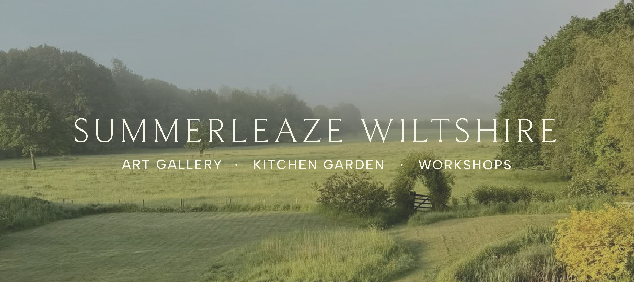 A scenic countryside landscape with green fields, trees, and a fence, overlaid with white text promoting Summerleaze Wiltshire art gallery, kitchen garden, and workshops.