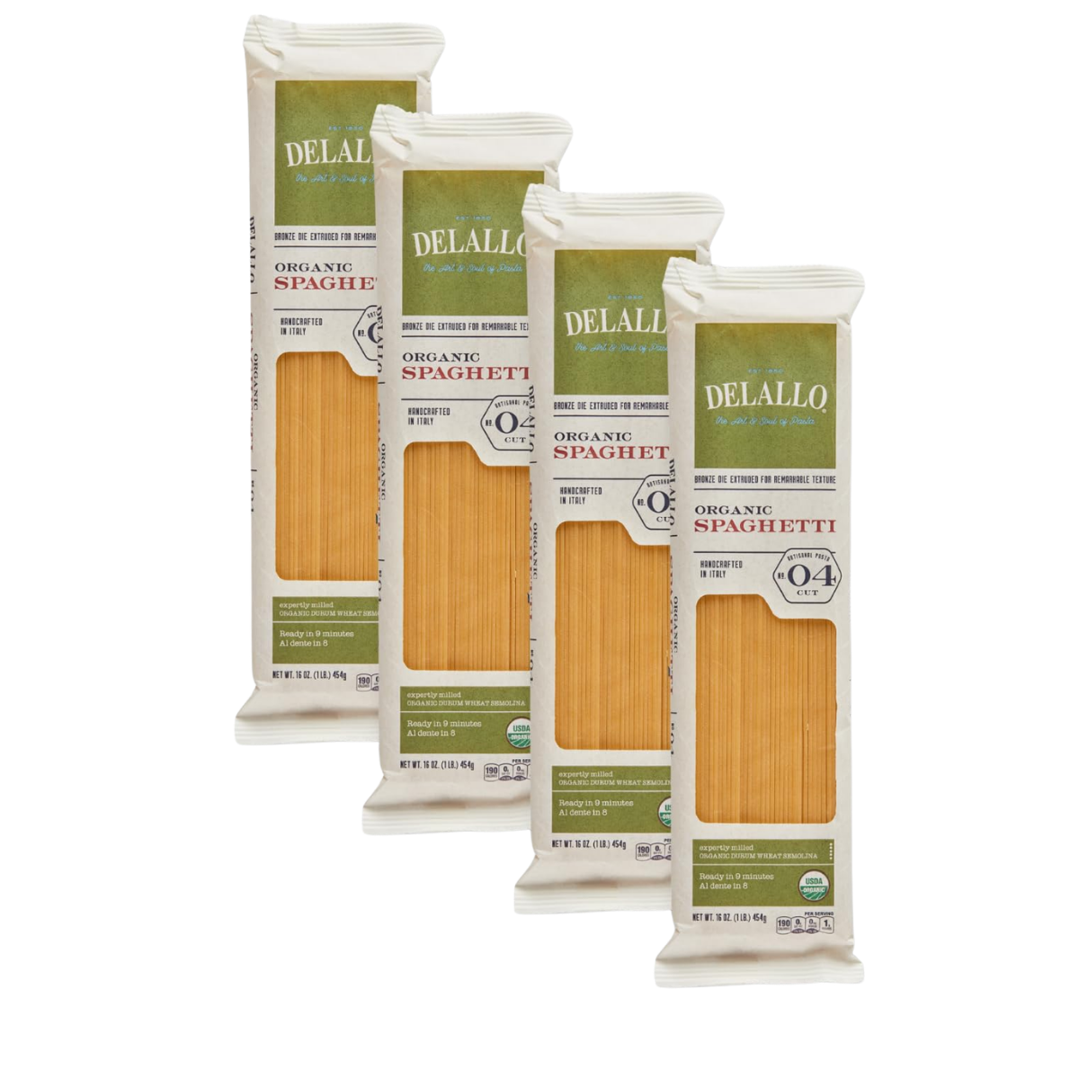 Four packages of organic spaghetti with transparent windows showing the pasta, featuring green and white labeling.