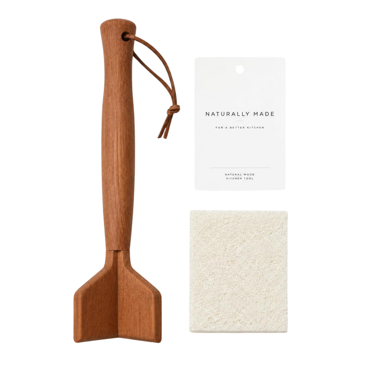 A wooden kitchen spatula, a white instruction booklet titled 'Naturally Made,' a large beige cleaning sponge, and a card with the text 'Natural Wood Kitchen Tool' are arranged on a dark background.