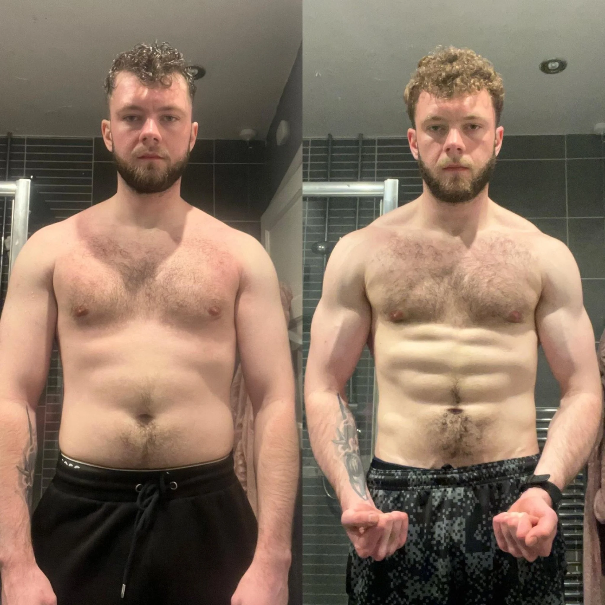 Side-by-side mirror selfies of a shirtless man with curly hair and a beard, wearing black shorts with white dots, in a bathroom with black tile walls and a silver towel rack.