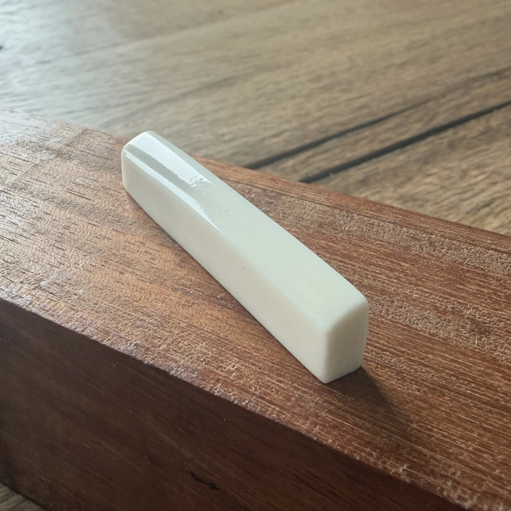 Handmade Norcross bone acoustic guitar nut.