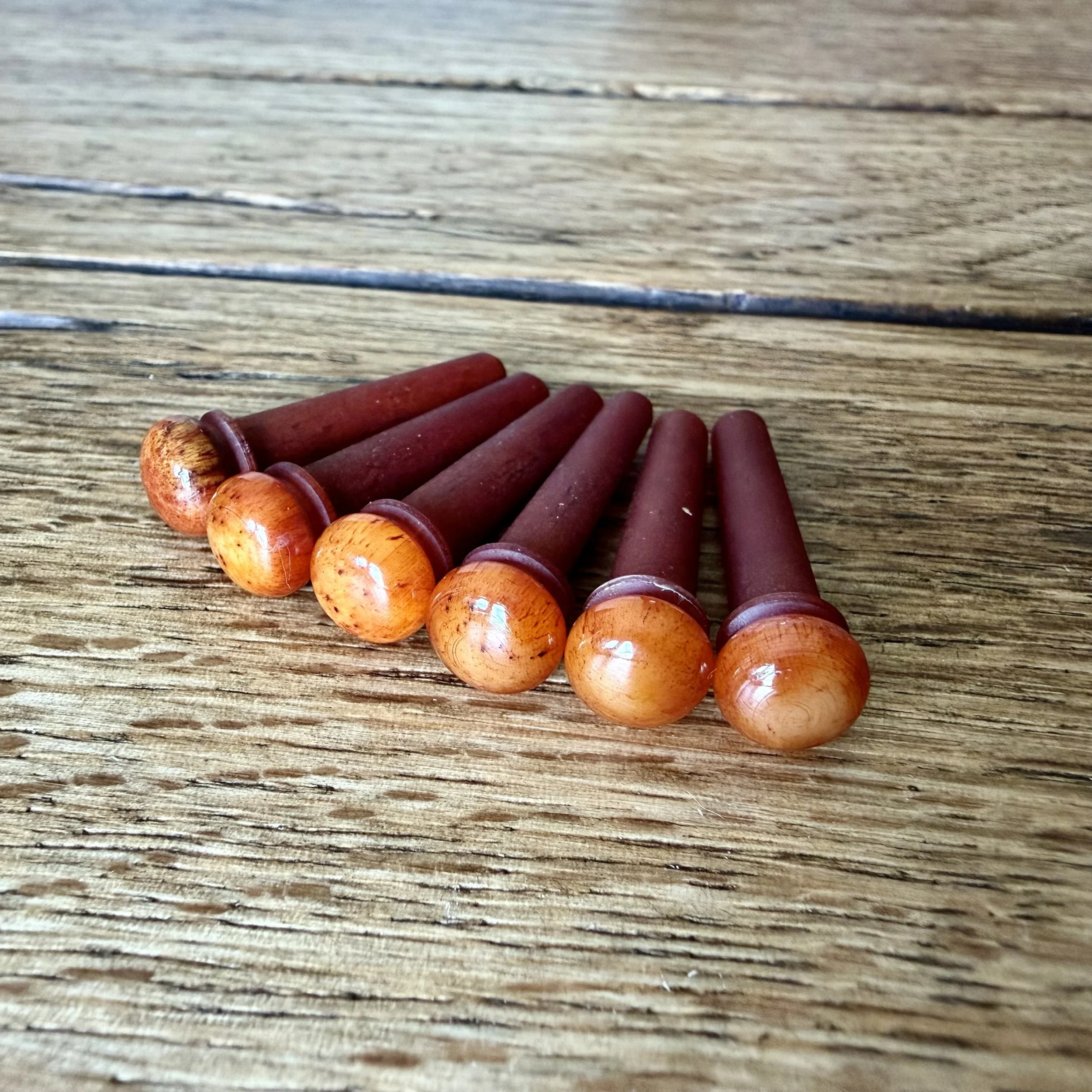 Custom acoustic guitar pins, dyed bone.